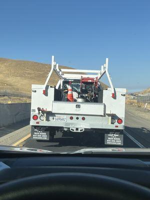 License place and company name visible. African american gentleman driving in work vest and aggressively yelling...