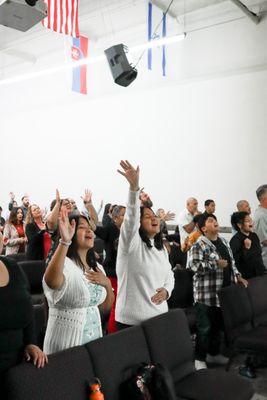 The congregation worshiping