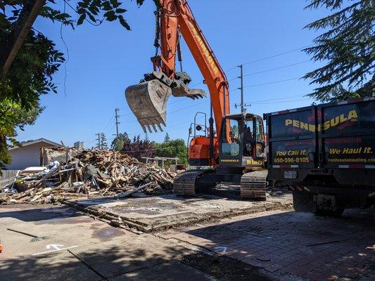 Lumber too old to reuse, to be taken to landfill.