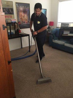 Daniel going to town cleaning the carpets