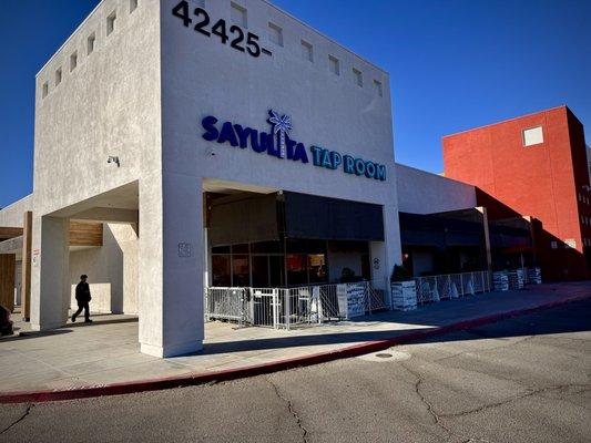 Exterior of Sayulita Tap Room with modern design and inviting outdoor seating.