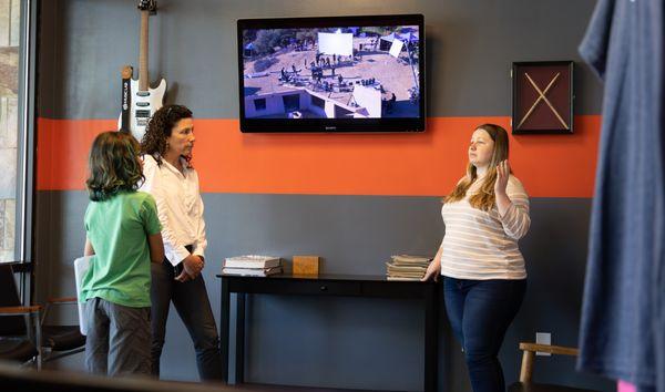 Debrief in the lobby of the student's progress.