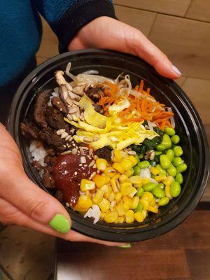 A beef bowl with all of our toppings including
Corn edamame carrots mushrooms spinach and bean sprouts