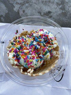 Waffle bowl with birthday cake ice cream and rainbow sprinkles