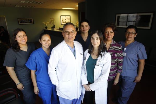 Dr. Carmen Morales, M.D. and Dr. Richard Huete, M.D., with staff