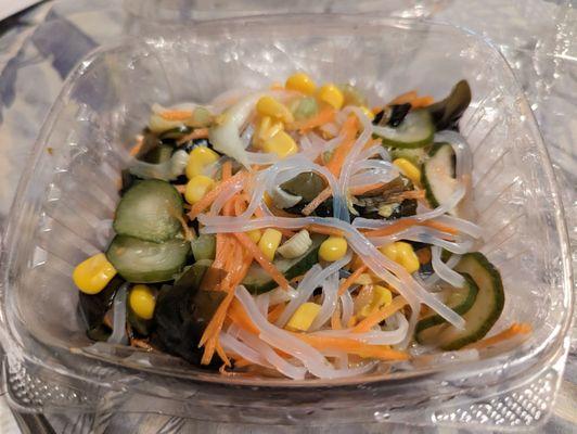 Glass noodle salad with cucumbers, seaweed, carrots, and corn