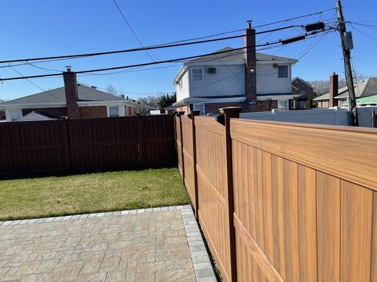 Wood grain PVC fence, vinyl illusions.  Awesome products.