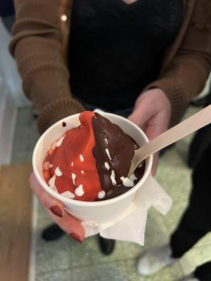 Ice cream with hard chocolate and hard strawberry topping