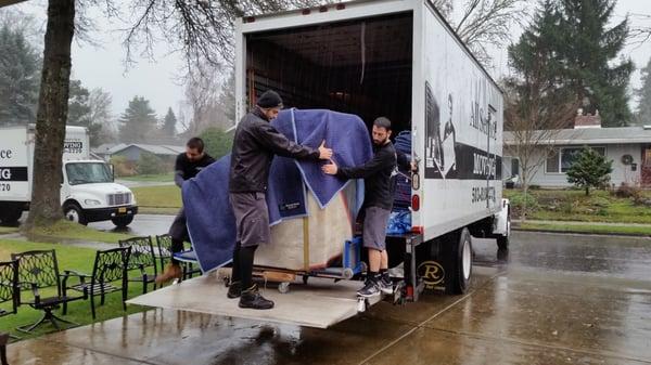 Here is the "A" team. In the rain with an 800 lb piano!