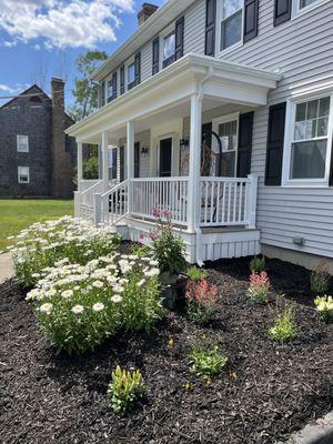 Finished front porch with new shutters and gutters