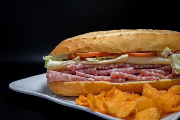 Salami Sandwich on French bread with a side of chips