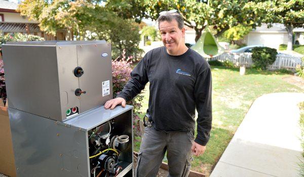 Andrew standing next to a Tempstar furnace (their favorite)