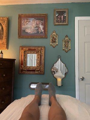 Comfy bed with Renaissance / retro decor ... love the vibe