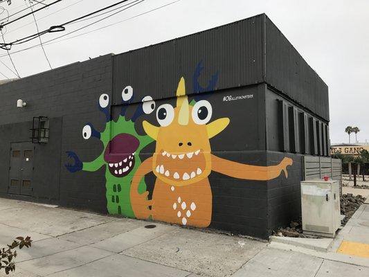 alley monsters mural on side of building for Architects Hanna Gabriel Wells Professional Corporation