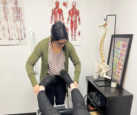 Dr. Nisreen adjusting a patient