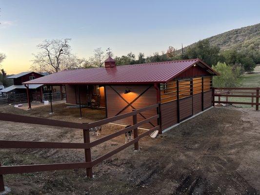 2 stalls open in the back into a holding paddock leading to pasture.