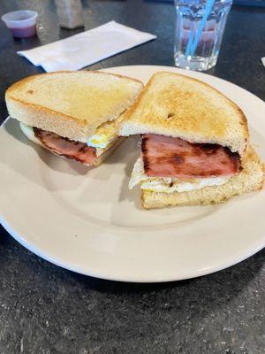 Egg sandwich with ham on sourdough toast