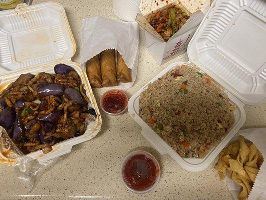 Eggplant Pork, Broccoli Chicken with Garlic Sauce, Pork Fried Rice and a side of egg rolls and a side of 12 fried wonton skins.