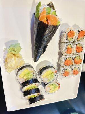 Salmon avocado hand roll, spicy tuna roll, cooked egg and avocado roll