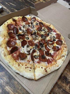 Large pepperoni, mushroom and olive pizza. It was pretty good!