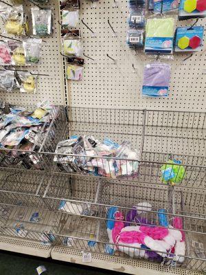 Rows and rows of mostly empty shelves throughout the store.