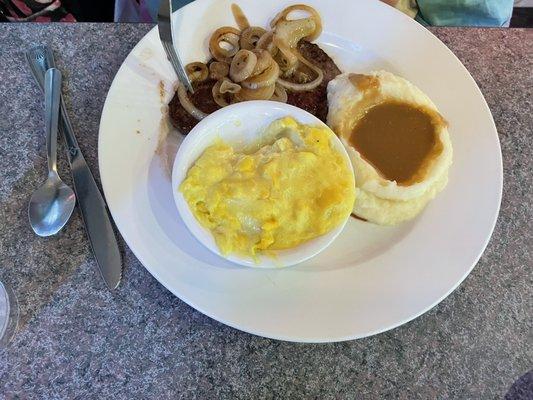 Lunch liver and onions with mashed potatoes, brown gravy and squash casserole.