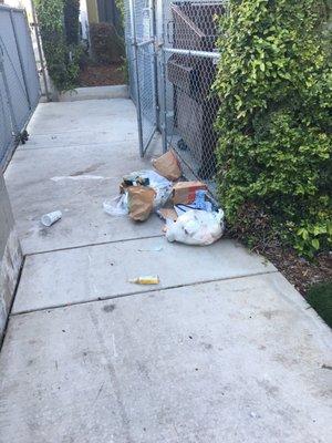 Homeless people are constantly going through the trash because the locks are broken and the property is not secure.