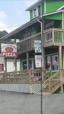 Outside - can't miss the neon green Pizzeria