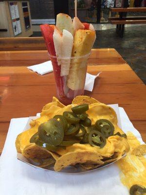 Chips and queso with jalapeño & fruit combination with lime and chili