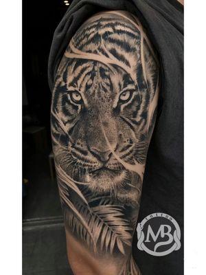 Realistic tiger arm tattoo