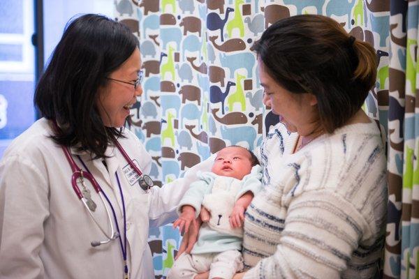 A mother brings her baby in for a well visit at our Walker Street location.