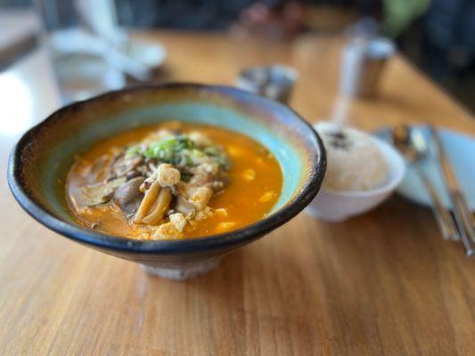 Soft tofu soup with different mushrooms served with rice and yummy banchan