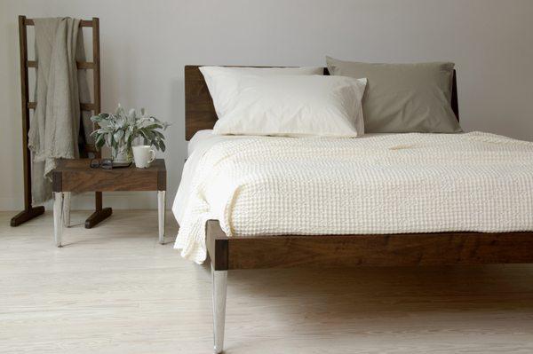 SALLY cotton waffle blanket + ANTON organic cotton bedding in ivory & khaki + BRUNO bed frame & bedside table in American walnut