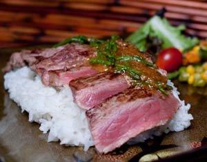 Best 4% Top N.Y. Sirloin
 with Teriyaki & Garlic
 Over fresh rice, organic salad, and potato/Mac salad.
 Cooked to your temp.+++