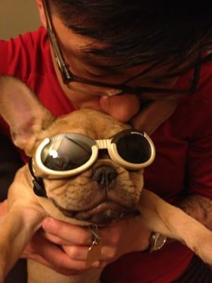 Ollie tries on her new sunglasses.