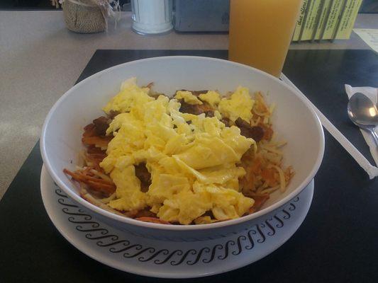 Hash brown bowl with sausage, and eggs hold the cheese,