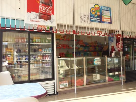 Sells laundry supplies and snacks. They have coffee, juice, soda, slushies, chips, cookies, water etc.