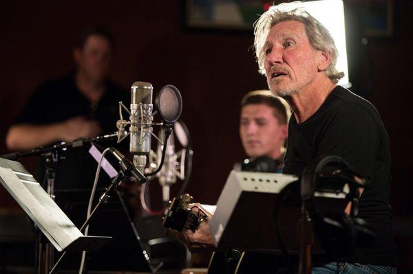 Roger Waters of Pink Floyd recording with wounded soldiers at Cue.