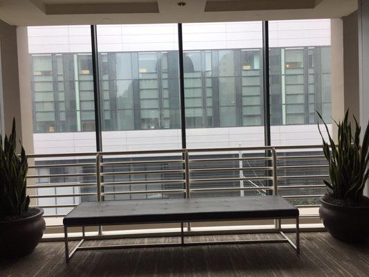 The atrium has sitting areas by the elevator if you can't stay in your medical or business reception if too crowded