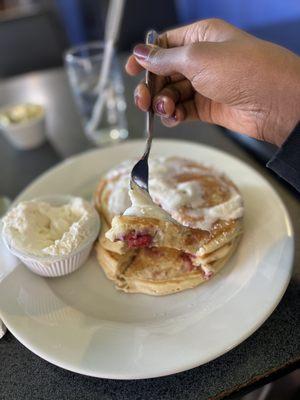 Old Glory Pancakes filled with Raspberries, White Chocolate Chips and a side of Vanilla Whipped Cream