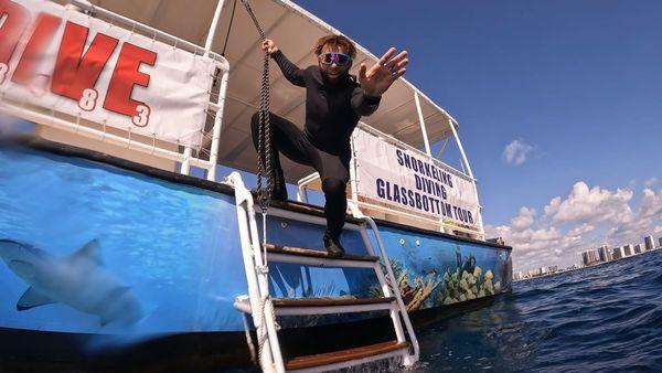 Warm welcome from dive master Collin , ready to help us on board