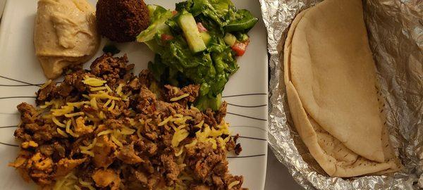 Chicken, beef, rice, house salad, falafeland pita from the meal for 2 special. We added a side of hummus