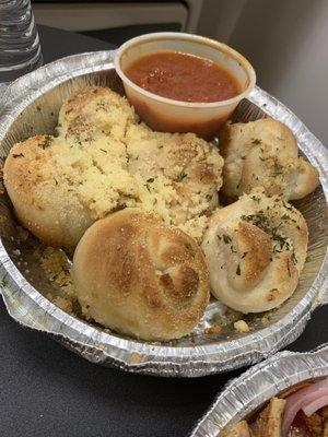 Rancid tomato sauce with old garlic bread.