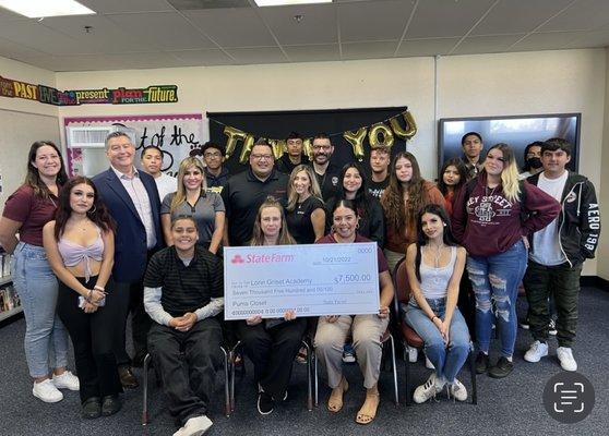 State Farm sponsorship check to high school students.