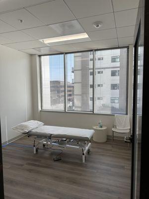 Treatment rooms with natural light to create a relaxing and therapeutic environment for patients and staff