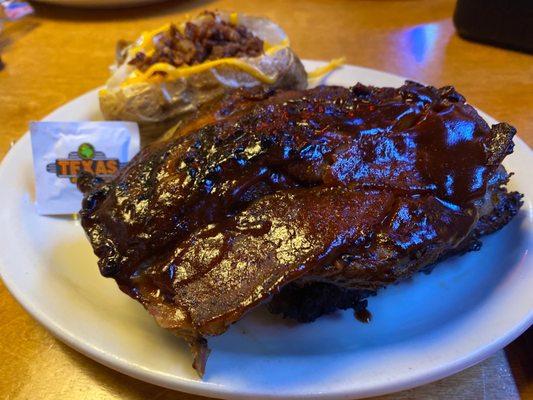 Ribs and a loaded baked potato