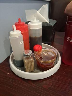 Condiments - ketchup, soy sauce, hoisin, and chili sauce