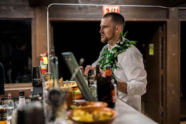 Groom chatting with the bar