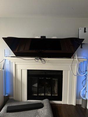 Tv falling forward due to poor Geek Squad fireplace tv bracket installation for a95k tv