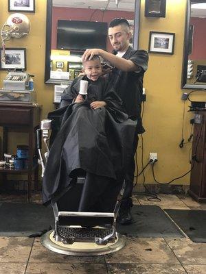 DJ cutting JJ's hair